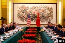 U.S. Commerce Secretary Wilbur Ross, second from left, and Chinese Vice Premier Liu He, fourth right, attend a meeting at the Diaoyutai State Guesthouse in Beijing, June 3, 2018.