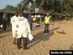 FILE - Police investigate after heavily armed gunmen opened fire at a popular Ivory Coast beach resort in Grand-Bassam, March 13, 2016.