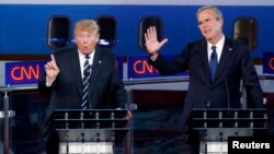 FILE - Then presidential candidate Donald Trump speaks as former Florida governor and fellow candidate Jeb Bush reacts during the second official Republican presidential debate at the Ronald Reagan Library in Simi Valley, California, Sept. 16, 2015. "You are never going to be president of the United States by insulting your way to the presidency,” Bush predicted at the time.