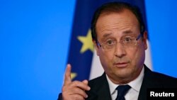 FILE - France's President Francois Hollande, Aug. 27, 2013.