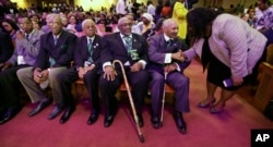 Five men who took part in the Memphis sanitation workers strike in 1968 wait for a ceremony to begin at the Mason Temple of the Church of God in Christ, Tuesday, April 3, 2018, in Memphis, Tenn.