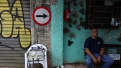 First aider Wellington Carvalho sits next to medical equipment in the city's biggest slum Paraisopolis after residents hired a 24-hour private medical service, in Sao Paulo, Brazil March 30, 2020.