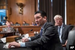 FILE - Scott Gottlieb, commissioner of the Food and Drug Administration, answers a question from a Senate committee at the Capitol in Washington, Oct. 5, 2017.