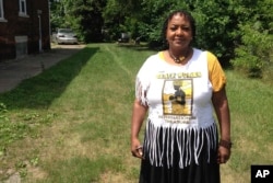 In this July 6, 2017 photo, Deborah Chenault Green discusses Detroit's 1967 riots from a vacant lot where her cousin's home once stood on the city's west side.