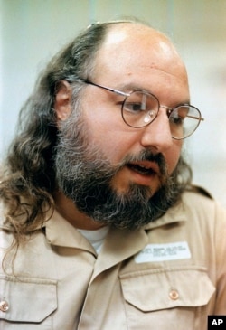 FILE - In this Friday, May 15, 1998 file photo, Jonathan Pollard speaks during an interview in a conference room at the Federal Correction Institution in Butner, N.C.