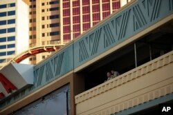 Police officers watch over the T-Mobile arena before an NHL hockey game in Las Vegas, Nevada, Oct. 13, 2017.