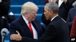President-elect Donald Trump, left, shakes hands with President Barack Obama before the 58th Presidential Inauguration at the U.S. Capitol in Washington, Jan. 20, 2017.