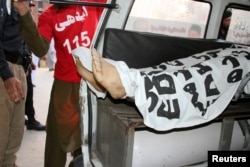 The body of Mashal Khan is seen loaded into an ambulance after a mob beat him to death at his university campus in Mardan, Pakistan, April 13, 2017.