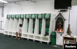 Leandro Bastos of Chapecoense's under-15 soccer team sits inside the team's locker room at the Arena Conda stadium in Chapeco, Brazil, Nov. 29, 2016.
