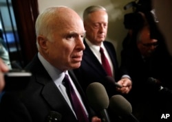 Sen. John McCain, R-Ariz., left, and Defense Secretary James Mattis, speak to members of the media after their meeting on Capitol Hill in Washington, Oct. 20, 2017.