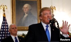 FILE - U.S. Vice President Mike Pence listens as U.S. President Donald Trump announces that the United States recognizes Jerusalem as the capital of Israel and will move its embassy there, during an address at the White House, Dec. 6, 2017.