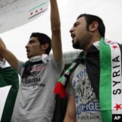 Syrian Kurds wearing Syrian opposition flags chant participate in a sit-in in front of UN headquarters in Beirut, Lebanon, in solidarity with anti-government protesters in Syria, April 29, 2012.