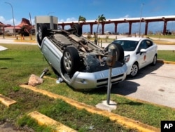 An overturned car is shown at the airport after Super Typhoon Yutu hit the U.S. Commonwealth of the Northern Mariana Islands, Oct. 26, 2018, in Garapan, Saipan.