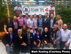 Canadian team True Patriot Love poses for a portrait with their support team. Four of the cyclists’ fathers are part of their Race Across America support team. The team consists of the eight men in the back row. From left to right: Michael Breech, Laurence Boma-Fisher, Bryan Murphy, Brady Jones, Luke Billington, Reid McGregor, Marcus Dagenais and Chris Slawson. “I think our group of riders kind of thrives on the challenge,” Slawson said. “Because ultimately that’s what we signed up for.”