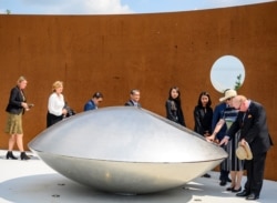 NETHERLANDS -- Relatives attend a commemoration ceremony in memory of the victims of the Malaysia Airlines flight MH17 plane crash on the fifth anniversary of the accident, in Vijfhuizen, June 17, 2019