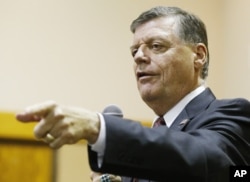 FILE - U.S. Rep. Tom Cole, R-Okla., shown at a town hall meeting in Moore, Oklahoma.