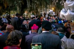 A group of clergy start a prayer vigil outside the Glynn County Courthouse where a jury started deliberating the trial of Greg McMichael, his son, Travis McMichael, and a neighbor, William "Roddie" Bryan, in Brunswick, Ga., Nov. 23, 2021.