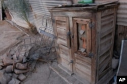 This is, or was, an ice box, in which a huge block of ice was placed in a zinc-lined portion of the cabinet. A drainage hose carried the water away as the ice melted.