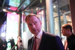 Christian Lindner, FDP party leader, leaves after attending a TV broadcast on the parliamentary elections in Berlin, Sept. 26, 2021.
