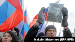 RUSSIA -- Russian opposition leader Aleksei Navalny (R) attends a rally in memory of opposition leader Boris Nemtsov, in Moscow, February 25, 2018