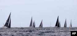 Some of the smaller boats enter open water during the start of the Sydney Hobart yacht race Sydney, Dec. 26, 2017.