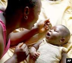 A young mother with child in Ngeima village, Kailahun District, Sierra Leone