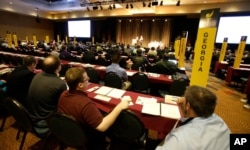 Delegates listen to speeches in the main hall at the National Libertarian Party Convention, May 27, 2016, in Orlando, Fla.