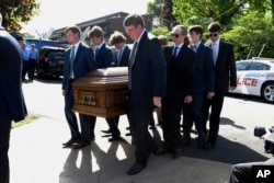 Pall bearers carry the casket of Riley Howell into the Stuart Auditorium for a memorial service in Lake Junaluska, N.C., May 5, 2019.