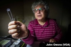 Sarkis Barsoumian, holding a gem, runs one of Bourj Hammoud's many jewelry workshops along with his brother Ohannes Barsoumian, Beirut, Lebanon, Feb. 26, 2016.