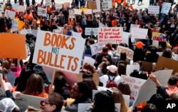 FILE - Hundreds of students gather at the Capitol in St. Paul, Minn., to protest gun violence, part of a national high school walkout on the 19th anniversary of the Columbine shootings, April 20, 2018.