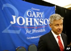 FILE - Libertarian presidential candidate Gary Johnson speaks to supporters and delegates at the National Libertarian Party Convention, in Orlando, Fla.