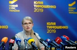 FILE - Yulia Tymoshenko, a former prime minister and candidate in Ukraine's upcoming presidential election, speaks at a news conference in Kyiv, Ukraine, Feb. 22, 2019. A fierce critic of incumbent President Petro Poroshenko, she has good chances to make it into the run-off vote as no candidate is predicted to win outright when Ukrainians go to the polls March 31.