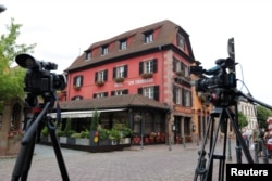 Media cameras and tripods are seen outside Le Chambard Hotel in Kaysersberg-Vignoble, France, June 8, 2018.