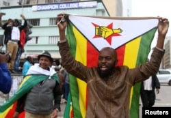 Protesters gather calling for Zimbabwean President Robert Mugabe to step down, in Harare, Zimbabwe, Nov. 18, 2017.