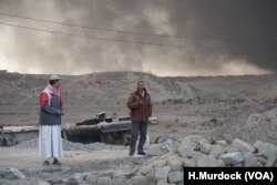 On the outskirts of Qayyarah, Iraq locals say oil fires left behind have raged almost unchecked for months, Nov. 5, 2016.