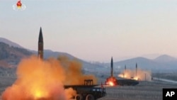 In this image made from video released by North Korea's state-owned broadcaster March 7, 2017, North Korea launches four missiles from an undisclosed location North Korea. 