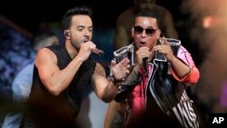 FILE - singers Luis Fonsi, left and Daddy Yankee perform during the Latin Billboard Awards in Coral Gables, Fla.