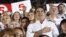 Georgia's President and leader of the ruling United National Movement party Mikheil Saakashvili gestures during the national anthem with his supporters during an election rally at a stadium in Tbilisi September 28, 2012. REUTERS/David Mdzinarishvili (GEOR