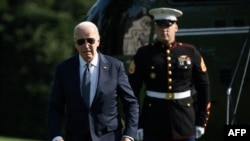 U.S. President Joe Biden walks on the South Lawn as he returns to the White House in Washington, Sept., 2024.