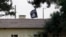 FILE - An Islamic State flag flies over the customs office of Syria's Jarablus border gate as seen from the Turkish town of Karkamis, in Gaziantep province, Turkey, Aug. 1, 2015.