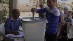 Defiant Assad Votes in Syria's Sham Poll