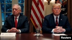 FILE - President Trump gets a briefing from his senior military leaders, including Defense Secretary James Mattis (L), in the Cabinet Room at the White House, October 23, 2018.