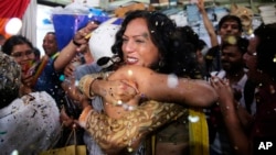 Supporters and members of India's LGBT community celebrate after the country's top court struck down a colonial-era law that makes homosexual acts punishable by up to 10 years in prison, in Mumbai, India, Thursday, Sept. 6, 2018. (AP Photo/Rafiq Maqbool)