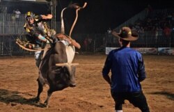 A rider competes during a rodeo event in Monte Negro, south of the Amazon basin, Rondonia state, Brazil, Aug. 30, 2019.