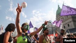 Demonstrators rally in favor of legalizing abortion outside the National Congress in Buenos Aires, Argentina, Dec. 29, 2020. 