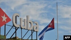 The Cuban national flag is lowered to half-staff in tribute to the victims of a plane crash, in Havana, May 19, 2018.
