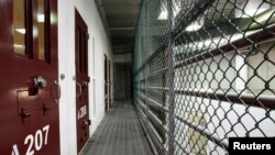 FILE - The interior of an unoccupied communal cell block is seen at Camp VI, a prison used to house detainees at the U.S. Naval Base at Guantanamo Bay on March 5, 2013. 