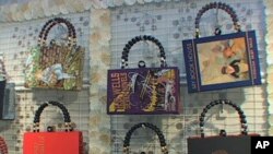 Caitlin Phillips turns discarded books into purses, here on display at the American Craft Council Show in Baltimore, Maryland.