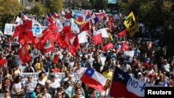 FILE - Demonstrators take part in a protest against national pension system in Valparaiso, Chile, March 26, 2017. 