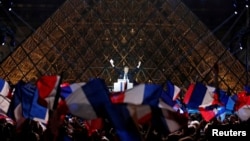 French President-elect Emmanuel Macron celebrates on the stage at his victory rally near the Louvre in Paris, France May 7, 2017. 